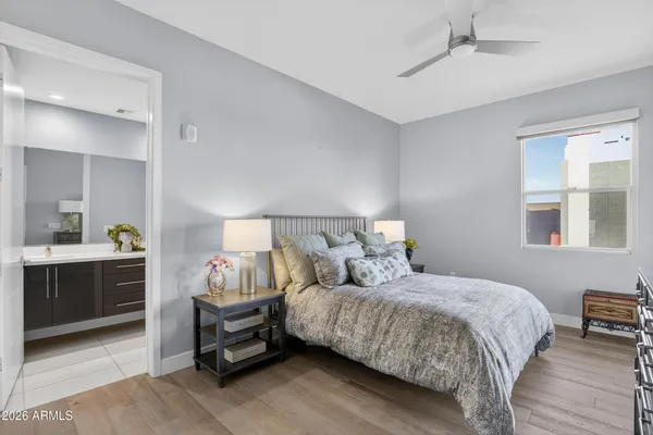 a bedroom with a bed and a table