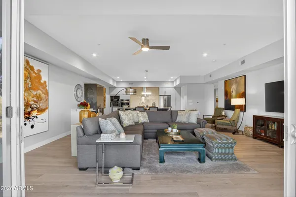 a living room with fireplace furniture and a flat screen tv