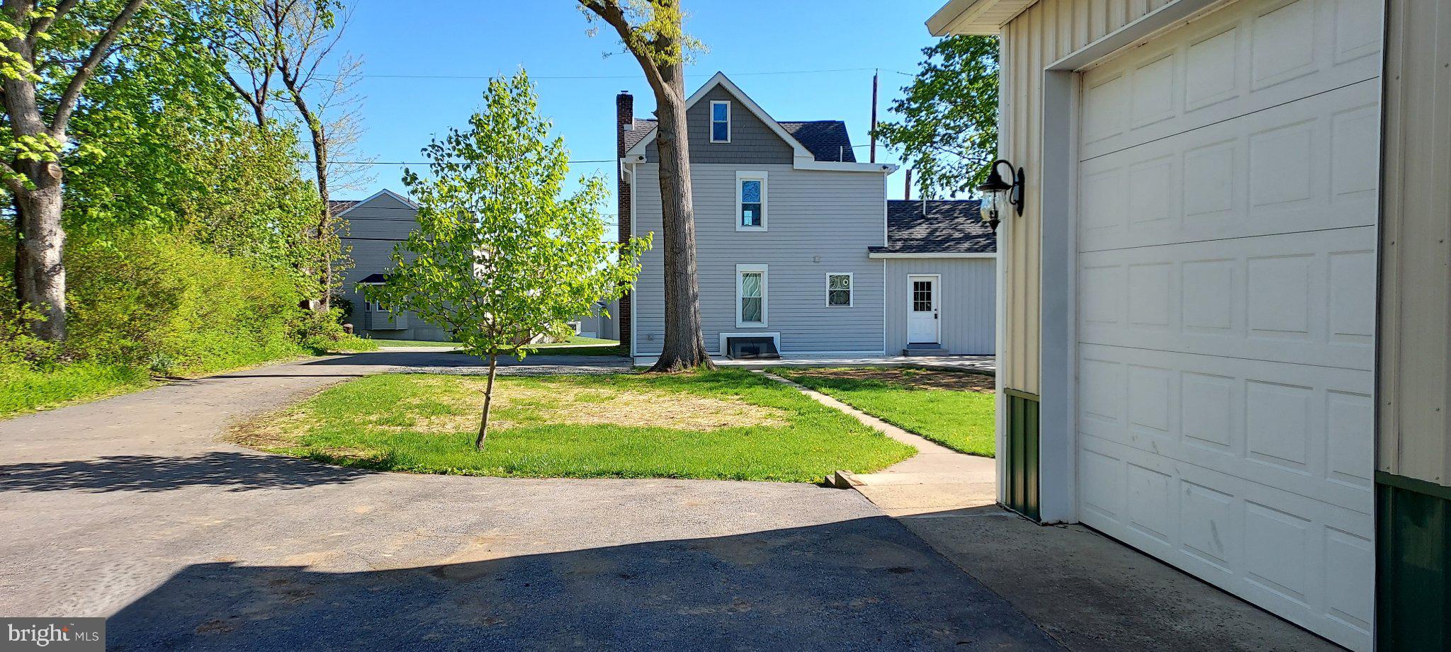 128 Maugers Mill Road Pottstown, PA 19464 - Photo 37 of 42 Charming home with lush greenery.