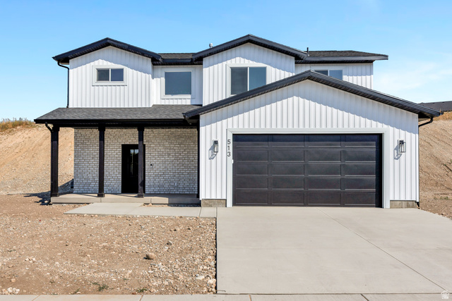 513 East Upper Cyn Road Smithfield, UT 84335 - Photo 1 of 1 Modern two-story residence featuring white board and batten siding with contrasting black trim