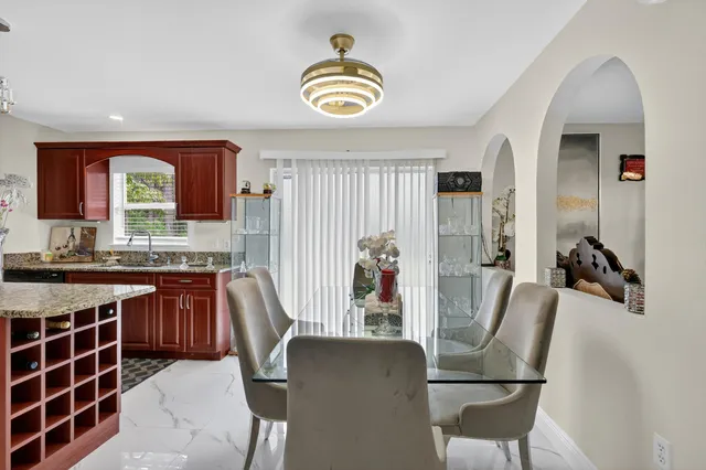 a view of kitchen with granite countertop lots of counter top space and furniture