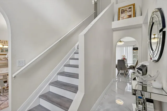a view of entryway and hall with wooden floor