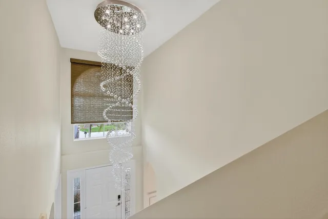a view of a chandelier fan in a room
