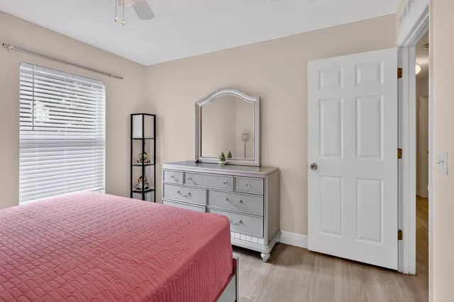 a bedroom with a bed and a dresser