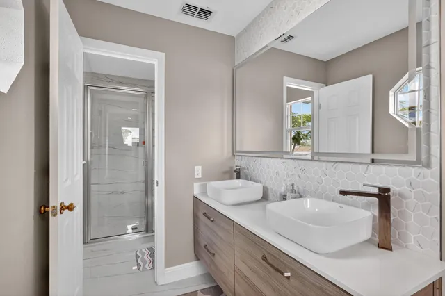 a bathroom with a sink and a mirror