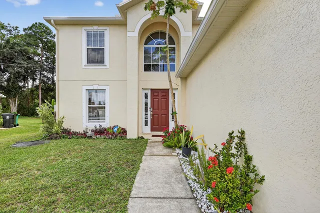 a view of a house with a garden
