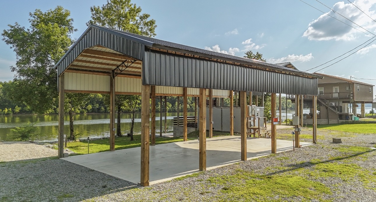 1085 WC PICKETT Road Clifton, TN 38425 - Photo 12 of 72 a view of a swimming pool with a porch and a yard