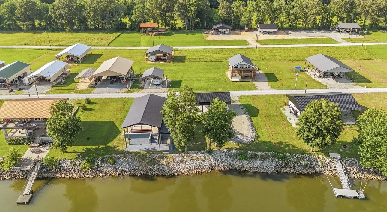 1085 WC PICKETT Road Clifton, TN 38425 - Photo 18 of 72 a view of a swimming pool with a lawn chairs and swimming pool
