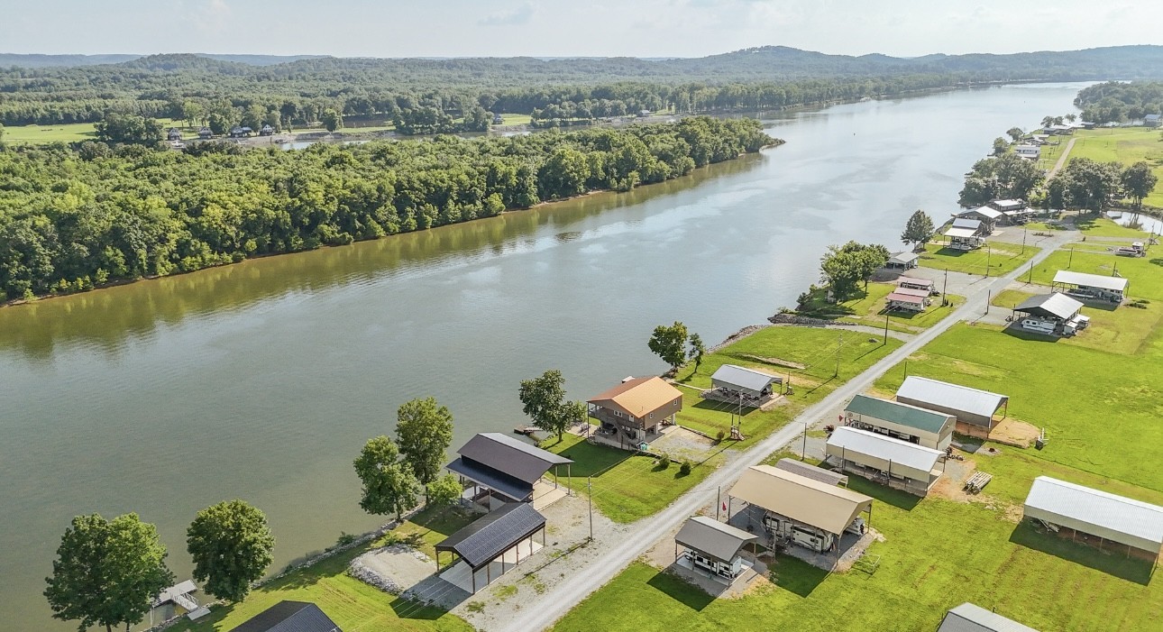 1085 WC PICKETT Road Clifton, TN 38425 - Photo 27 of 72 an aerial view of a house with a lake view