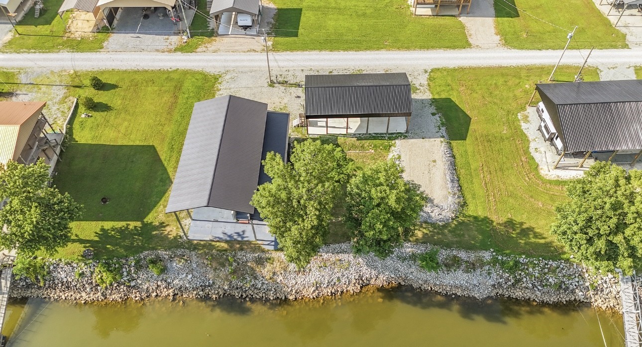 1085 WC PICKETT Road Clifton, TN 38425 - Photo 3 of 72 an aerial view of a house with a swimming pool