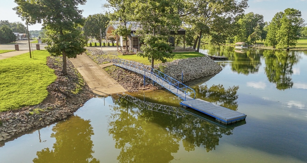 1085 WC PICKETT Road Clifton, TN 38425 - Photo 38 of 72 a view of a lake with a house in the background