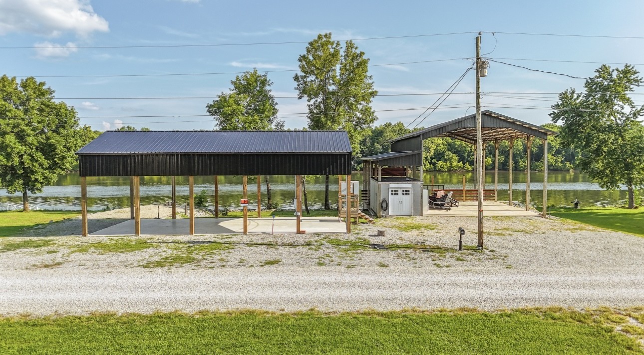 1085 WC PICKETT Road Clifton, TN 38425 - Photo 44 of 72 a view of a house with a backyard and a patio