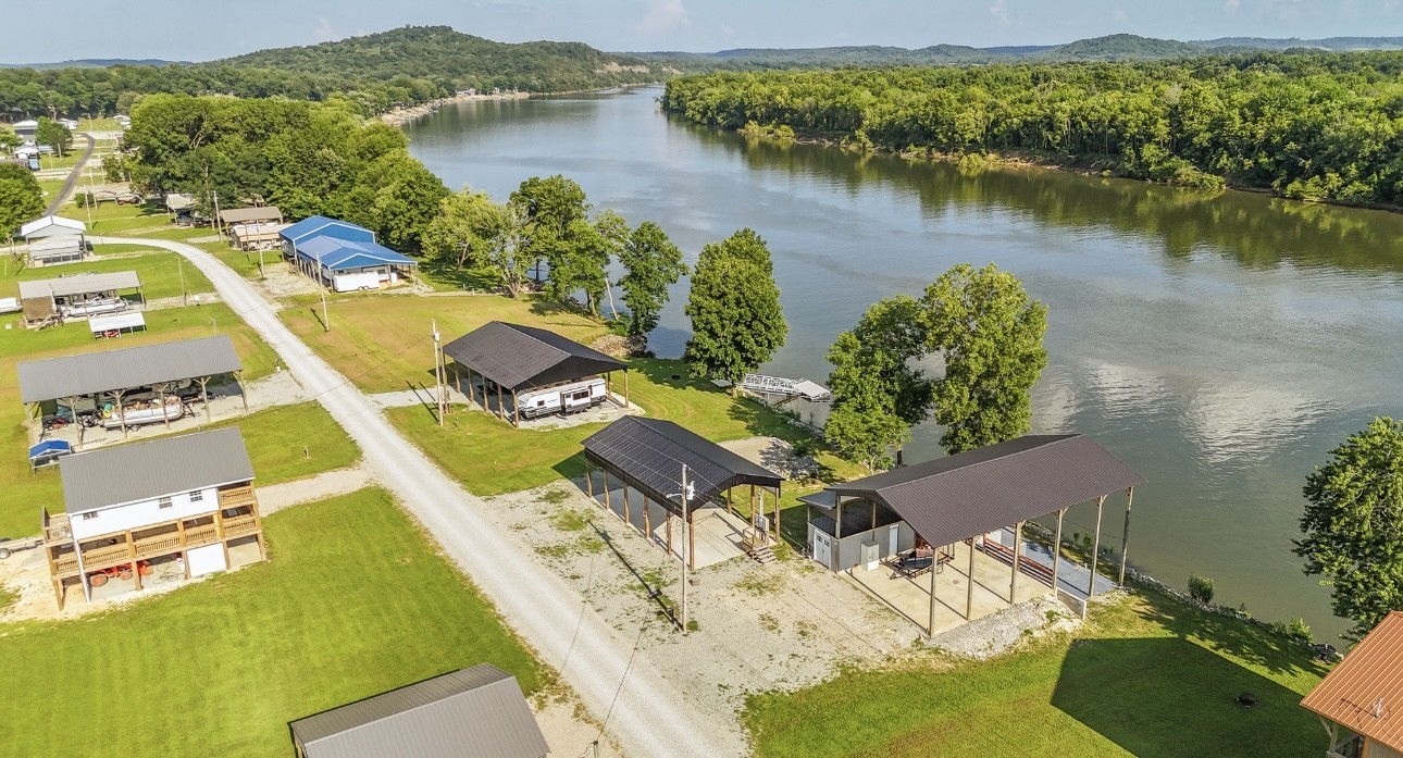 1085 WC PICKETT Road Clifton, TN 38425 - Photo 45 of 72 an aerial view of a house with a lake view
