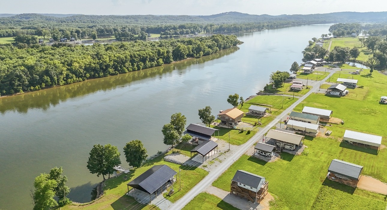 1085 WC PICKETT Road Clifton, TN 38425 - Photo 47 of 72 an aerial view of a house with a lake view