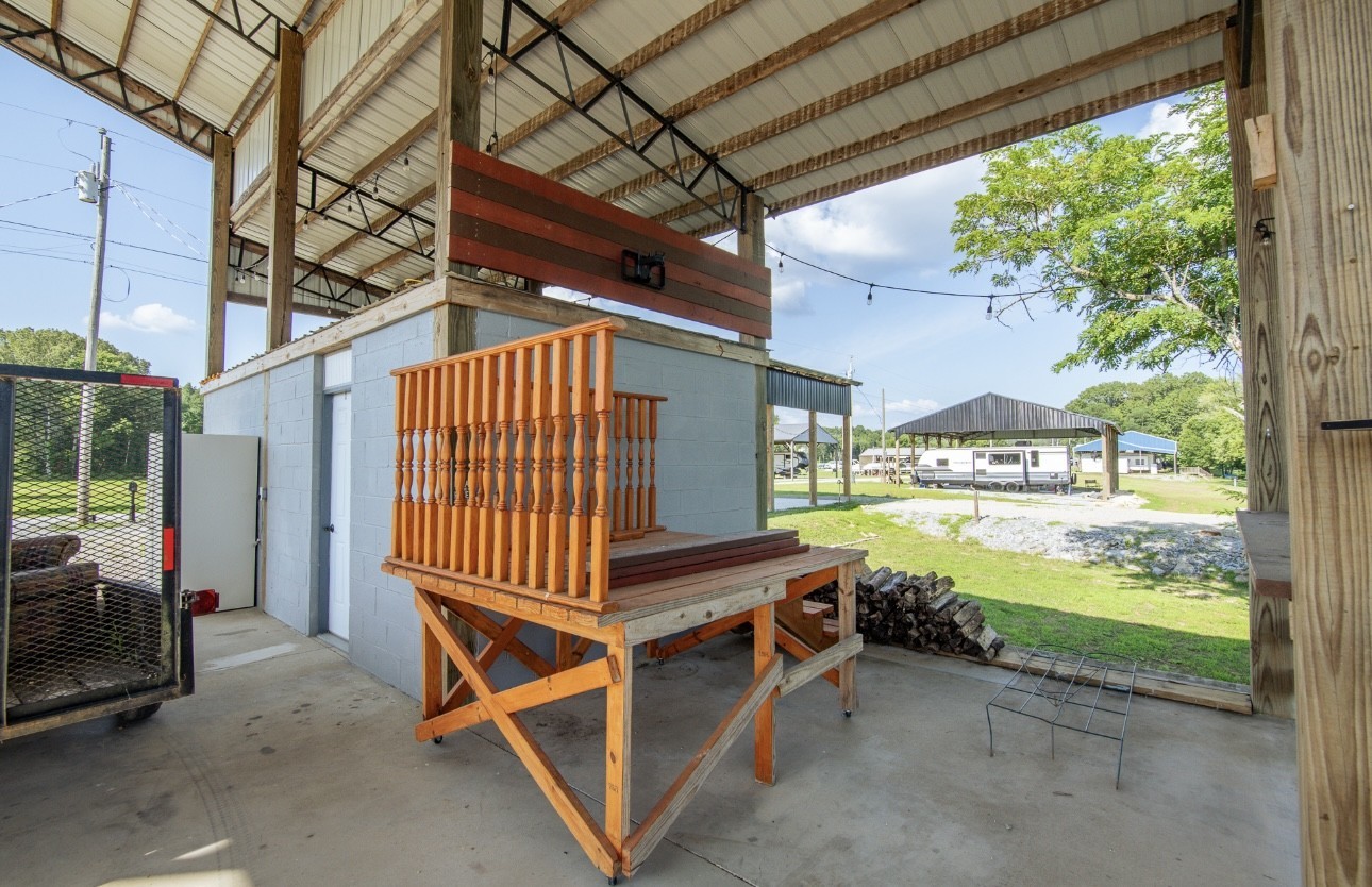 1085 WC PICKETT Road Clifton, TN 38425 - Photo 56 of 72 a view of a porch with furniture and a yard