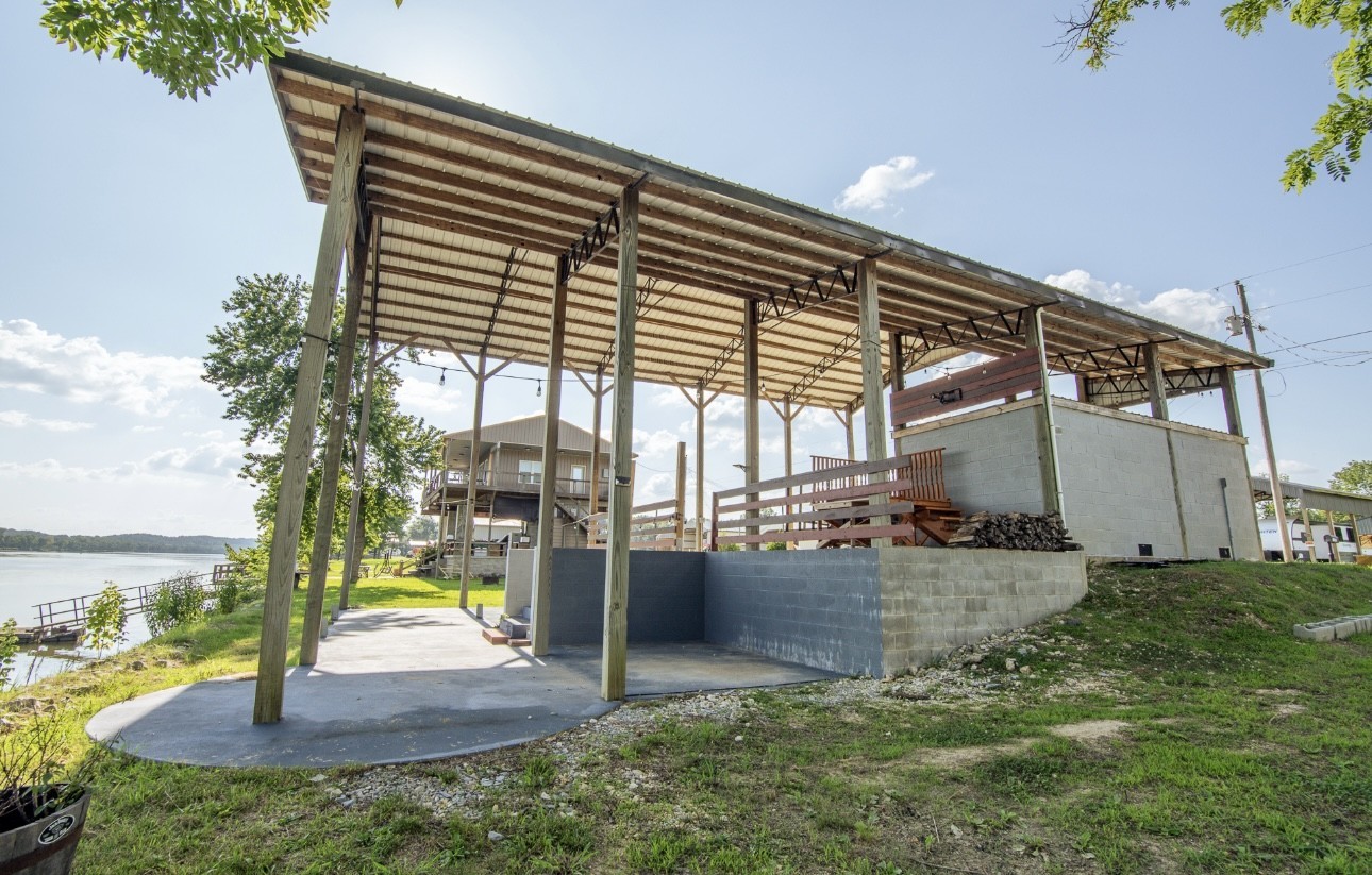 1085 WC PICKETT Road Clifton, TN 38425 - Photo 58 of 72 a view of a house with a backyard