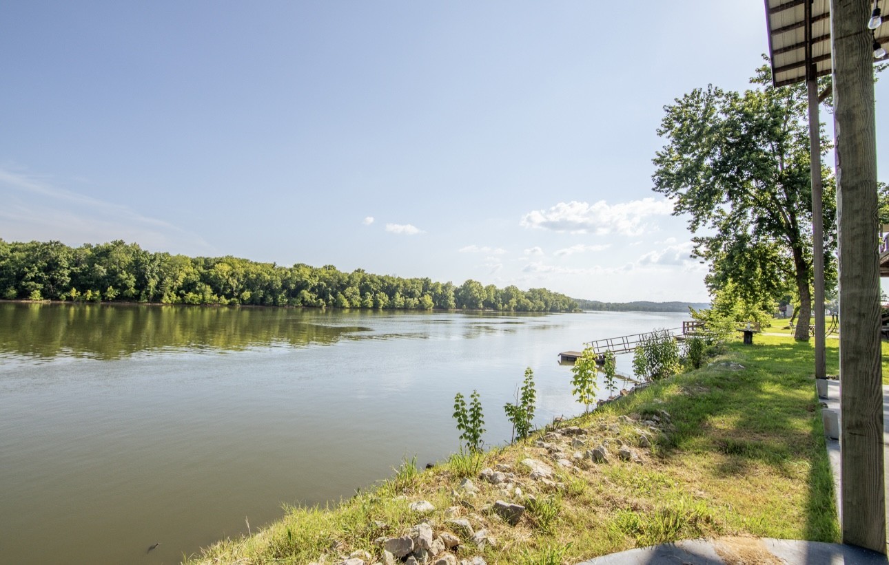 1085 WC PICKETT Road Clifton, TN 38425 - Photo 60 of 72 a view of a lake with a city