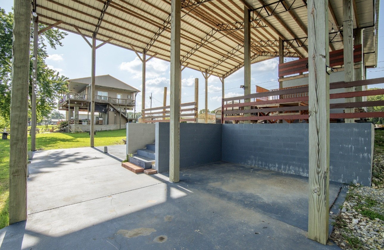 1085 WC PICKETT Road Clifton, TN 38425 - Photo 61 of 72 a view of a swimming pool with a porch