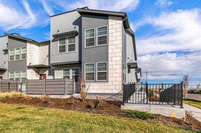 a front view of a house with a backyard