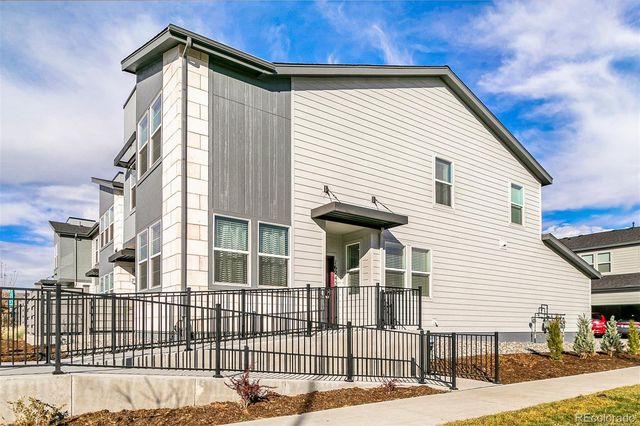 a view of a house with a iron gate