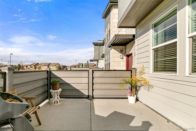 a view of a balcony with furniture