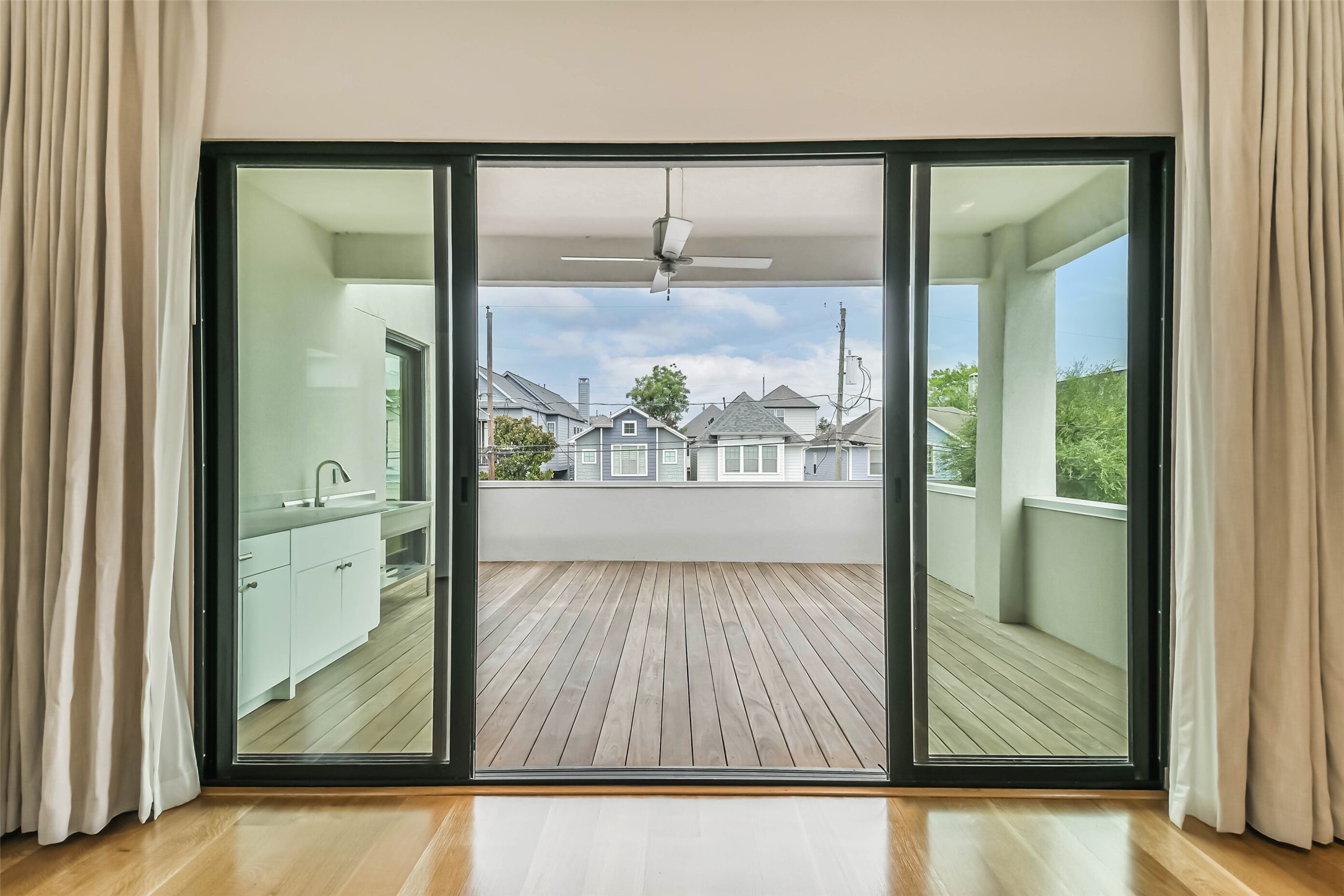 815 Alexander Street Houston, TX 77007 - Photo 41 of 49 Oversized sliding glass doors create a seamless connection between the interior living spaces and the private outdoor retreat.