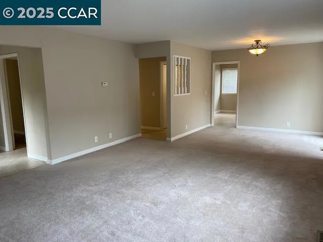 a view of an empty room and window