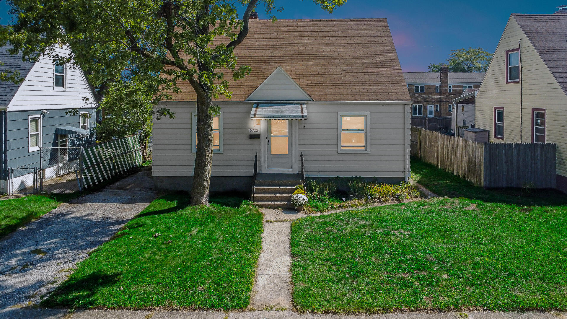 6723 Baring Avenue Hammond, IN 46324 - Photo 4 of 23 a front view of a house with garden