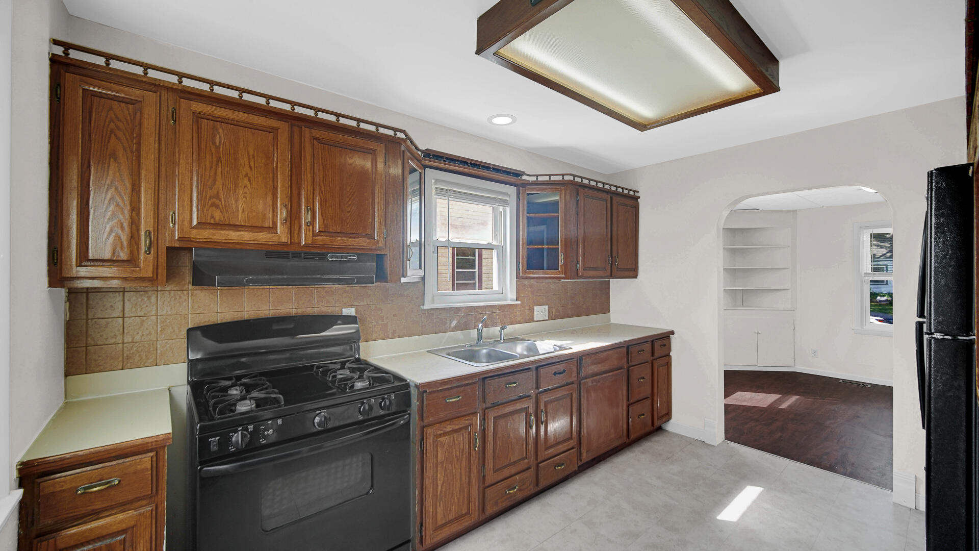6723 Baring Avenue Hammond, IN 46324 - Photo 7 of 23 a kitchen with a stove and a refrigerator