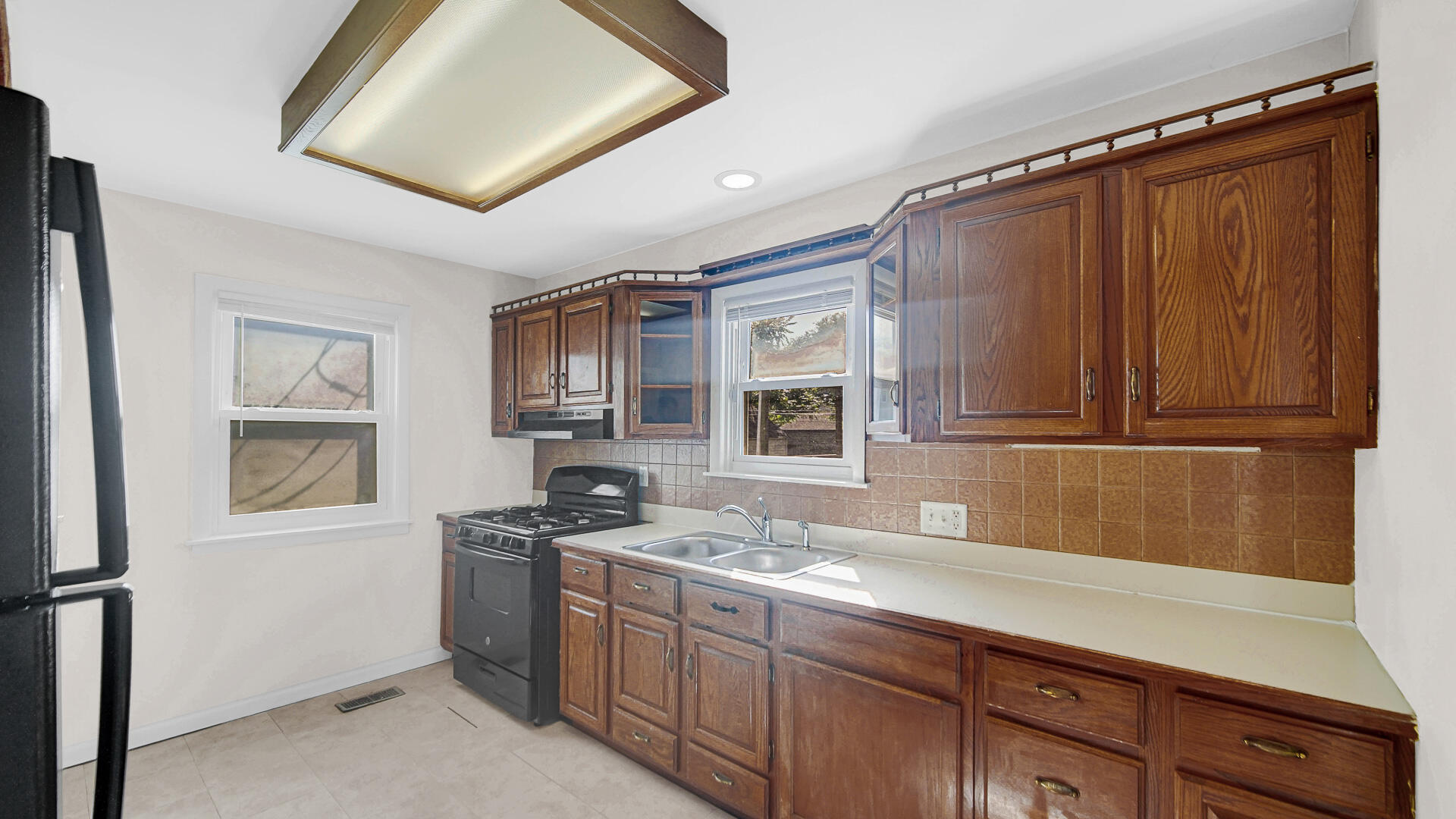 6723 Baring Avenue Hammond, IN 46324 - Photo 8 of 23 a kitchen with granite countertop stainless steel appliances a sink stove and cabinets