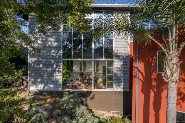 an aerial view of a house with yard swimming pool and outdoor seating