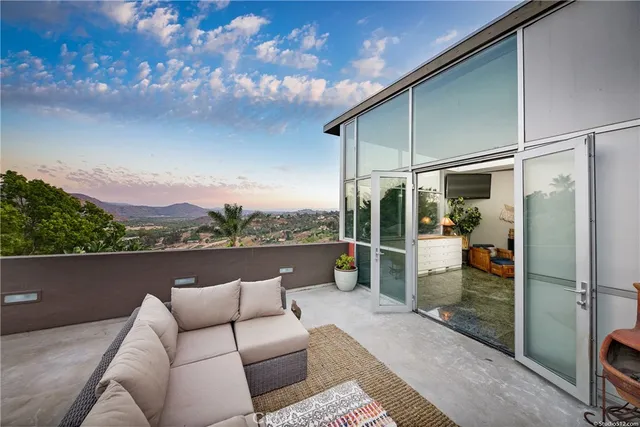 an aerial view of a house with yard swimming pool and outdoor seating