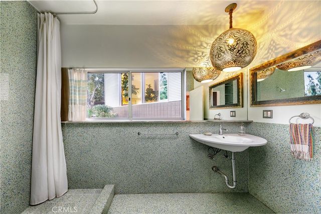 a view of living room with furniture and floor to ceiling window