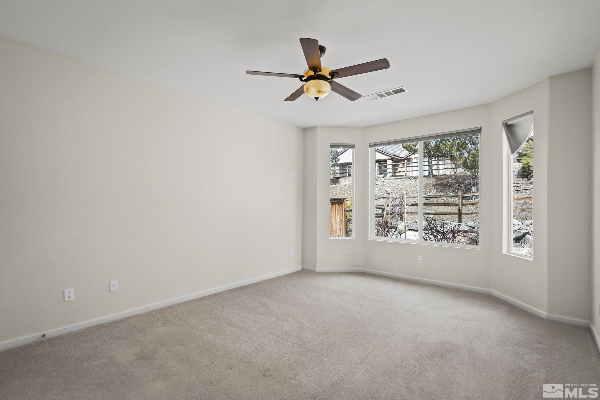 9185 Heritage Ridge Court Reno, NV 89523 - Photo 12 of 31 a view of an empty room with a window