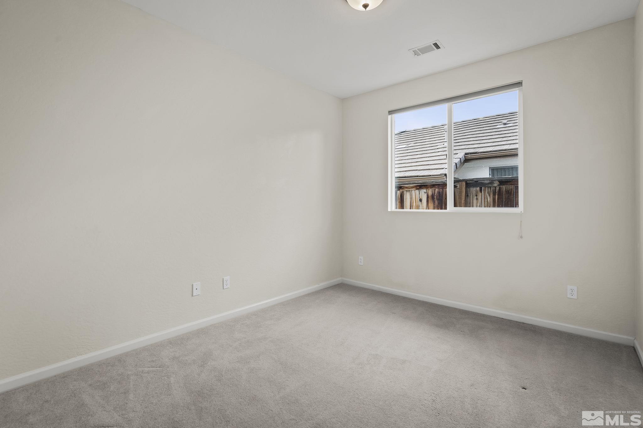 9185 Heritage Ridge Court Reno, NV 89523 - Photo 15 of 31 an empty room with a window