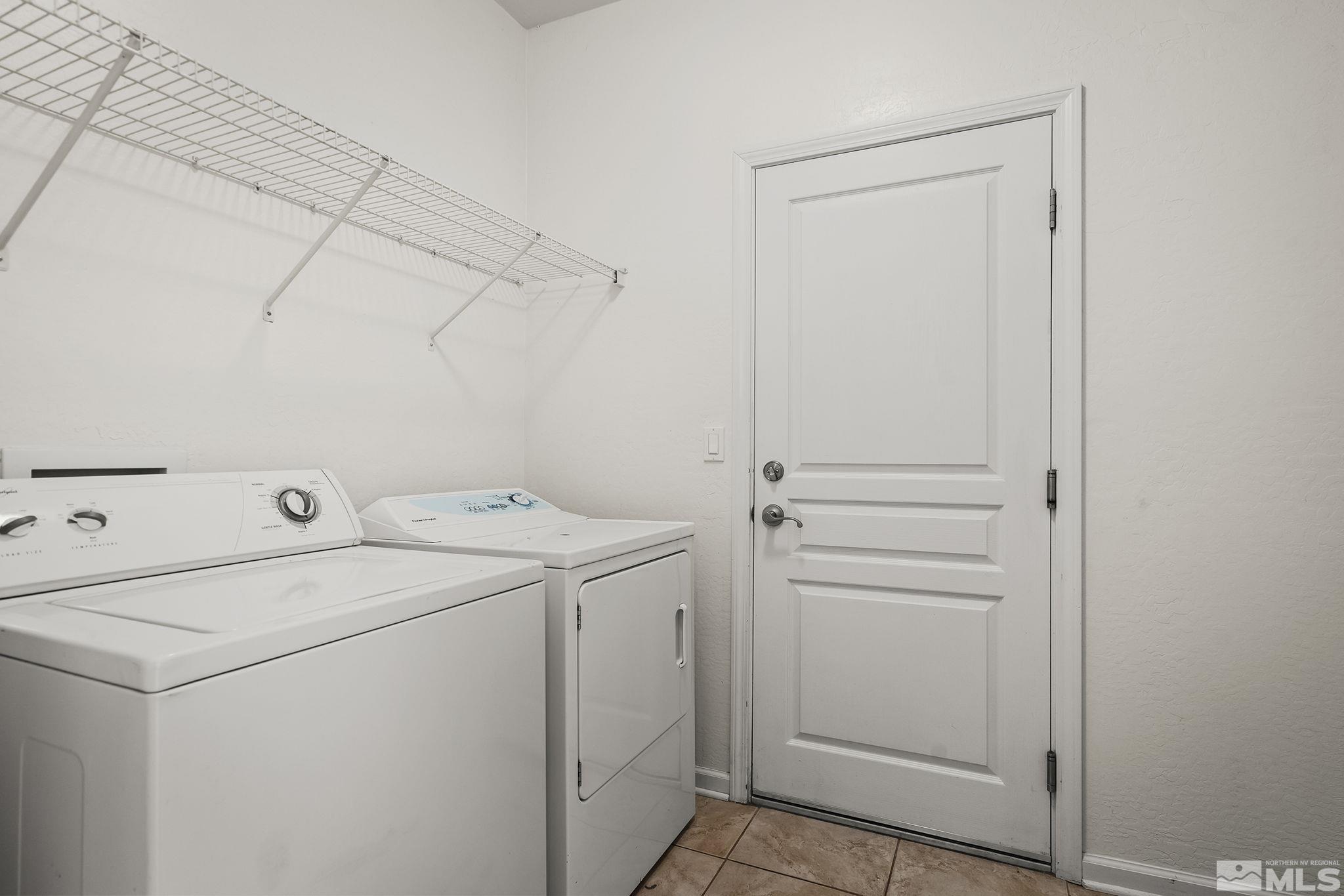 9185 Heritage Ridge Court Reno, NV 89523 - Photo 17 of 31 a view of storage and utility room with washer and dryer