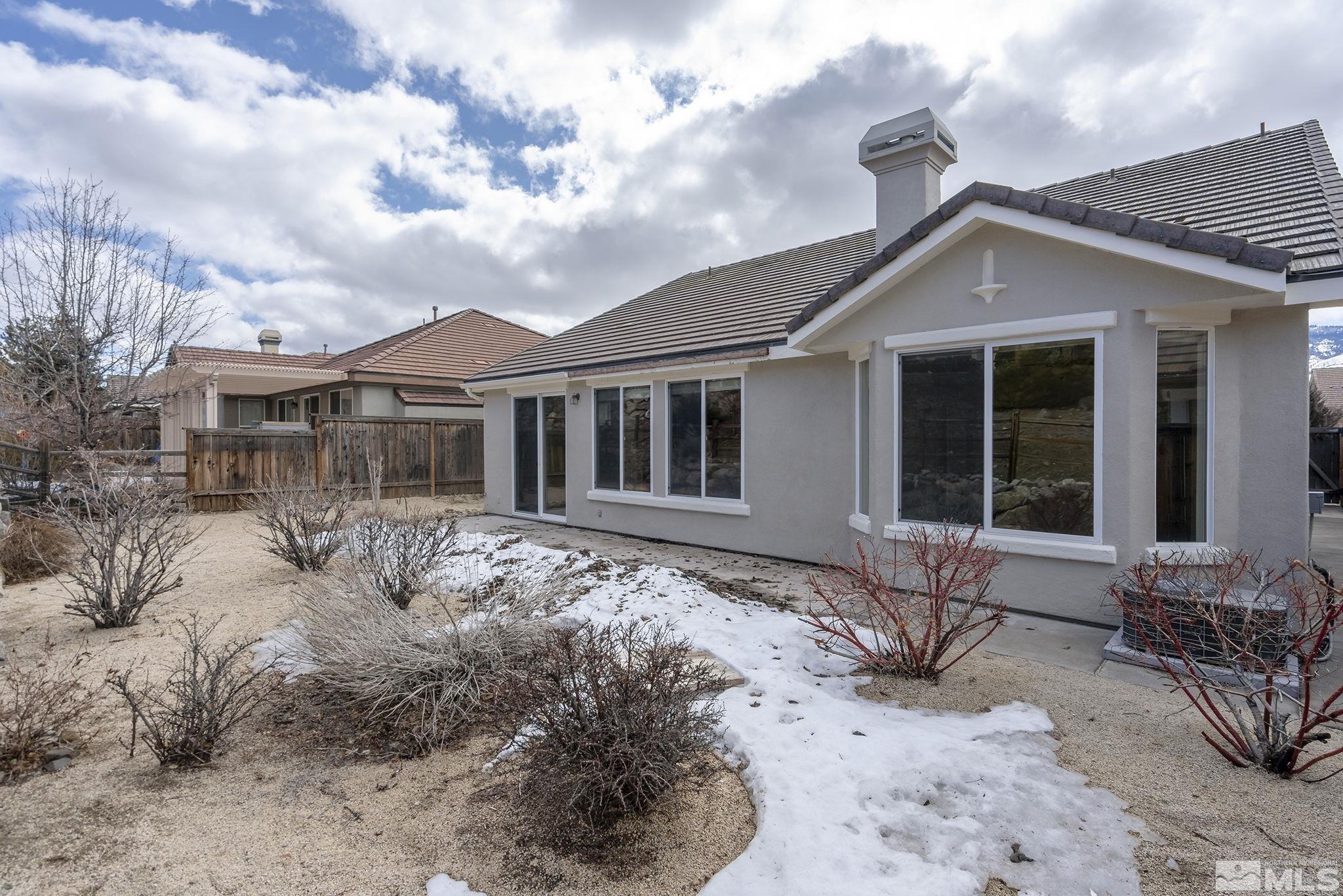 9185 Heritage Ridge Court Reno, NV 89523 - Photo 18 of 31 a front view of house with yard outdoor seating and barbeque oven