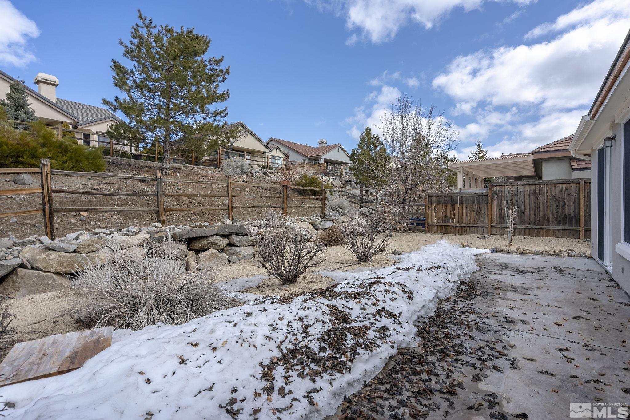 9185 Heritage Ridge Court Reno, NV 89523 - Photo 20 of 31 a view of a yard covered with snow