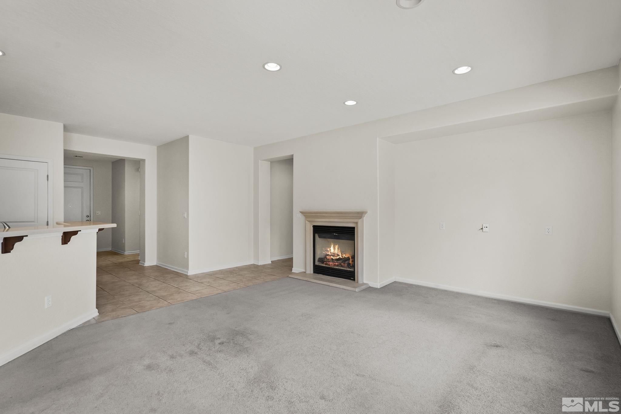 9185 Heritage Ridge Court Reno, NV 89523 - Photo 5 of 31 a view of an empty room with a fireplace
