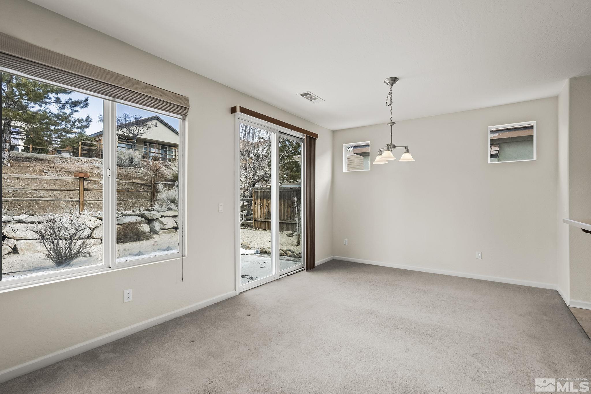 9185 Heritage Ridge Court Reno, NV 89523 - Photo 7 of 31 a view of an empty room with a window