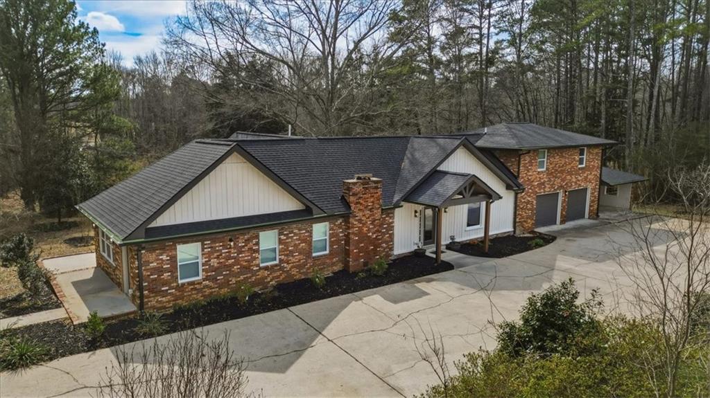4911 Lower Jersey Road Oxford, GA 30054 - Photo 2 of 56 a front view of a house with yard