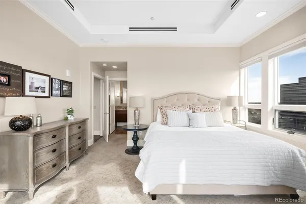 a bedroom with a bed and a cabinets