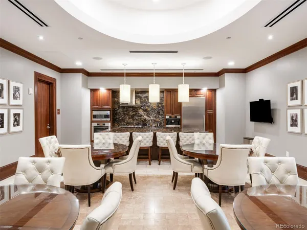 a living room with furniture large window and a fireplace