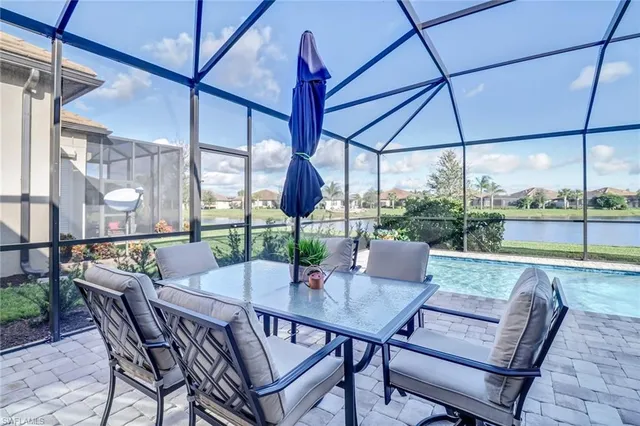 a view of an outdoor dining space with furniture and table
