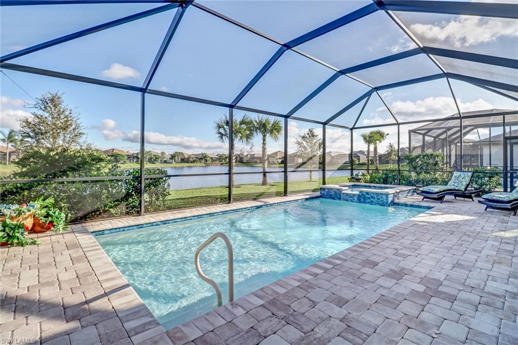 7567 Winding Cypress Drive Naples, FL 34114 - Photo 22 of 24 a view of swimming pool with a patio