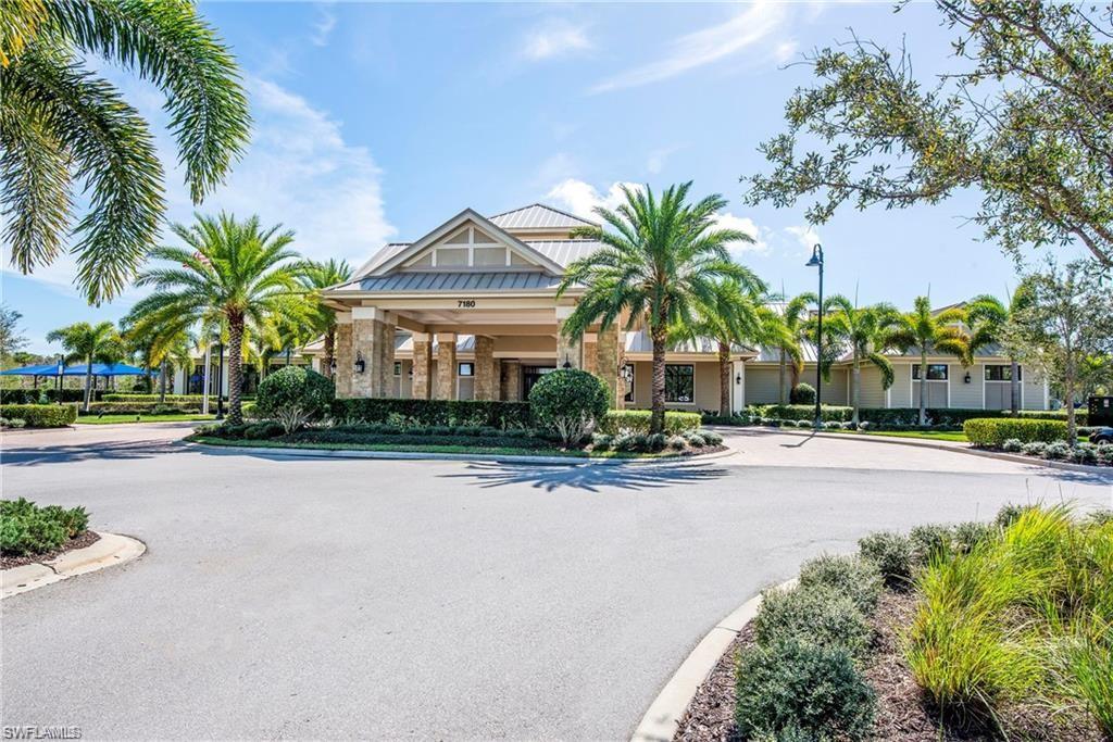 7567 Winding Cypress Drive Naples, FL 34114 - Photo 24 of 24 a front view of multiple houses with yard and green space