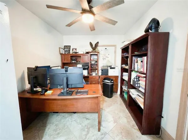 a room with furniture and flat screen tv