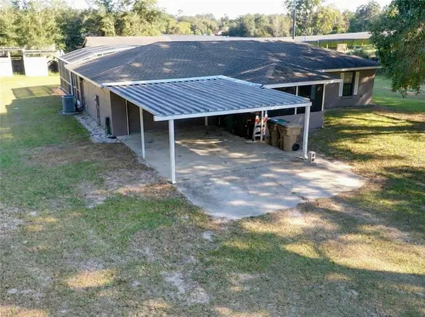 a view of a wooden deck front of house