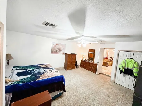 a bedroom with a bed and furniture