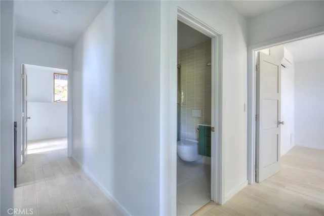 a view of a bathroom from a hallway